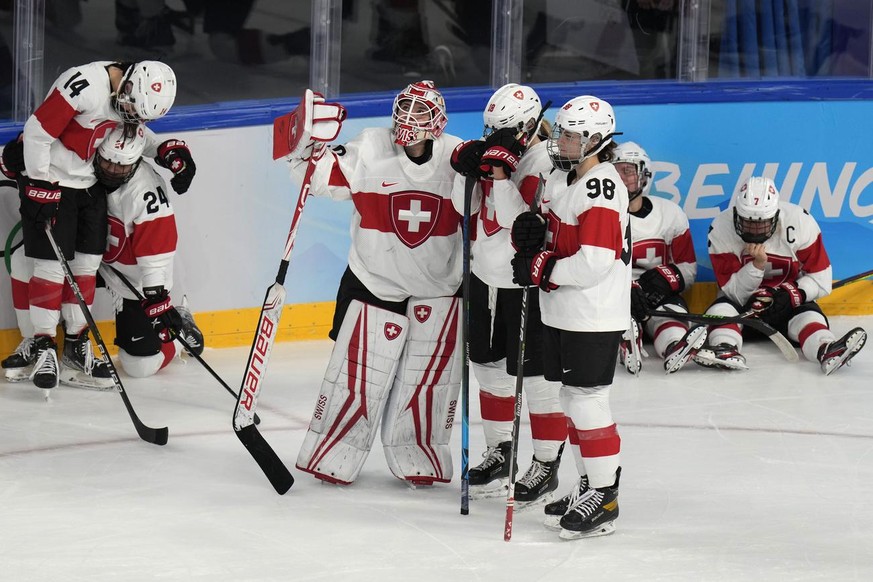 Switzerland reacts after losing to Finland in the women&#039;s bronze medal hockey game at the 2022 Winter Olympics, Wednesday, Feb. 16, 2022, in Beijing. (AP Photo/Petr David Josek)