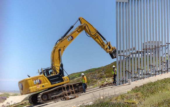 TIJUANA, MEXICO - JUNE 20: Workers construct a new wall along the southernmost part of the US-Mexico border, seen from Tijuana, Mexico on June 20, 2023 in Tijuana, Mexico. Friendship park, the site of ...