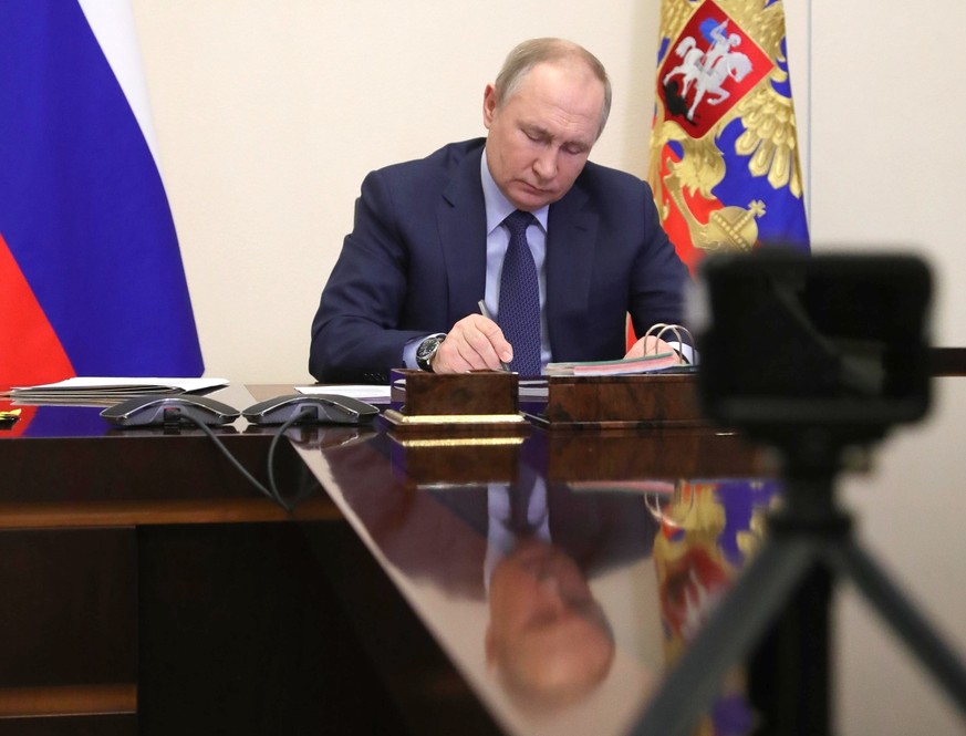 FILE - Russian President Vladimir Putin attends a meeting via videoconference in Moscow, Russia, March 25, 2022. (Mikhail Klimentyev/Sputnik, Kremlin Pool Photo via AP, File)