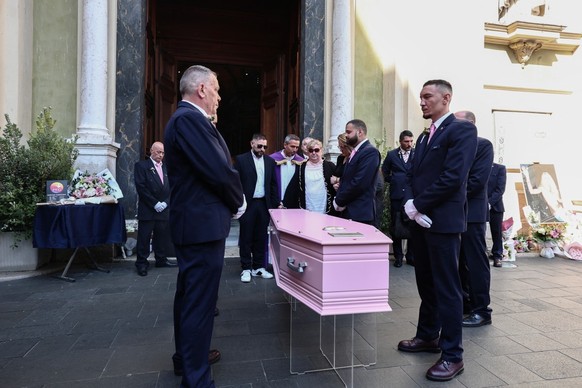 Violette Petrucciani (C), mother of Loana, stands in front of the coffin of Loana Petrucciani, the first reality TV star in France, during her funeral ceremony at the cathedral of Sainte-Reparate in N ...