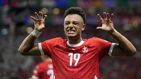 Switzerland&#039;s Dan Ndoye celebrates after scoring his sides first goal during a Group A match between Switzerland and Germany at the Euro 2024 soccer tournament in Frankfurt, Germany, Sunday, June ...