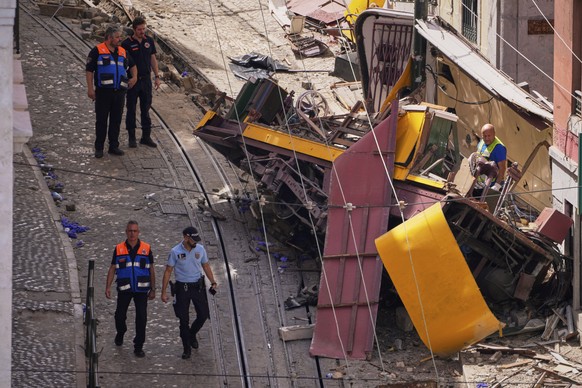 Police officers inspect the site where a tourist streetcar derailed and crashed in Lisbon, Portugal, Thursday, Sept. 4, 2025. (AP Photo/Armando Franca)
APTOPIX Portugal Streetcar Derailed