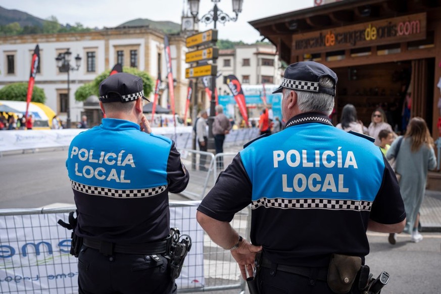 Two local police officers (Policia) provide security during a Spanish trail running event, on 14th May 2022, in Congas de Onis, Picos Mountains, Asturias, Spain. (Photo by Richard Baker / In Pictures  ...