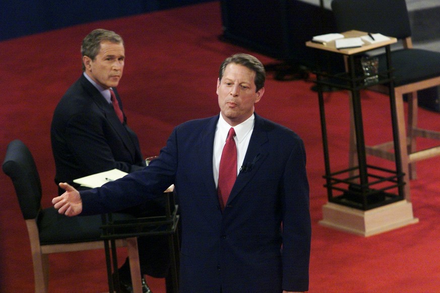 UNITED STATES - CIRCA 2000: Texas Gov. George W. Bush looks on as Vice President Al Gore responds to a quesiton in the third and final presidential debate at Washington University in St. Louis. (Photo ...