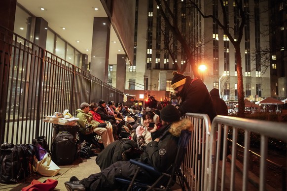 A line for court access is formed outside Manhattan Criminal Court, Tuesday, April 4, 2023, in New York. Former President Donald Trump is facing multiple charges of falsifying business records, includ ...