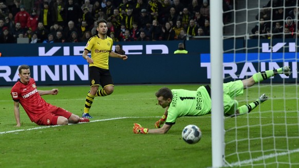 Dortmund&#039;s Raphael Guerreiro scores his side third goal during the German Bundesliga soccer match between Bayer Leverkusen and Borussia Dortmund in Leverkusen, Germany, Saturday, Feb. 8, 2020. (A ...