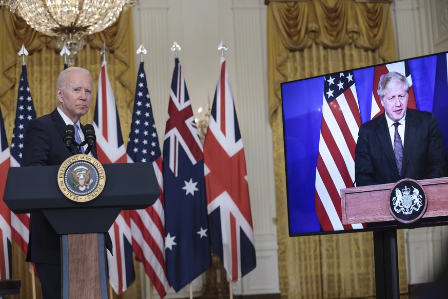 epa09470742 US President Joe Biden participates in a virtual press conference on national security initiative in the East Room of the White House in Washington, DC, USA, 15 September 2021. Australian  ...