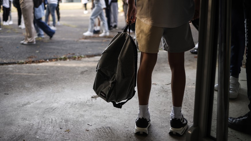 epa10152315 Junior high school students stand in the courtyard on the first day of school following summer break at Lycee Francois Truffaut high school in Bondoufle, south of Paris, France, 01 Septemb ...