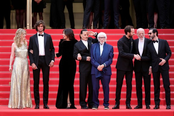 CANNES, FRANCE - MAY 16: (L to R) Pauline Pollmann, Diego Le Fur, Director Maïwenn, Johnny Depp, Pierre Richard, Benjamin Lavernhe, Pascal Greggory and Melvil Poupaud attend the &quot;Jeanne du Barry& ...