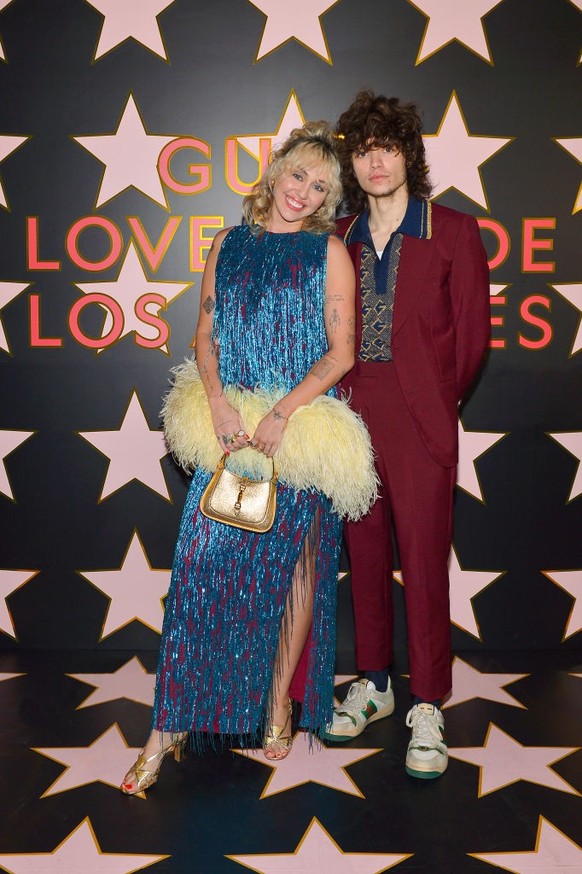 LOS ANGELES, CALIFORNIA - NOVEMBER 02: (EDITORS NOTE: This image has been retouched) Miley Cyrus and Maxx Morando arrive at Gucci Love Parade on November 02, 2021 in Los Angeles, California. (Photo by ...