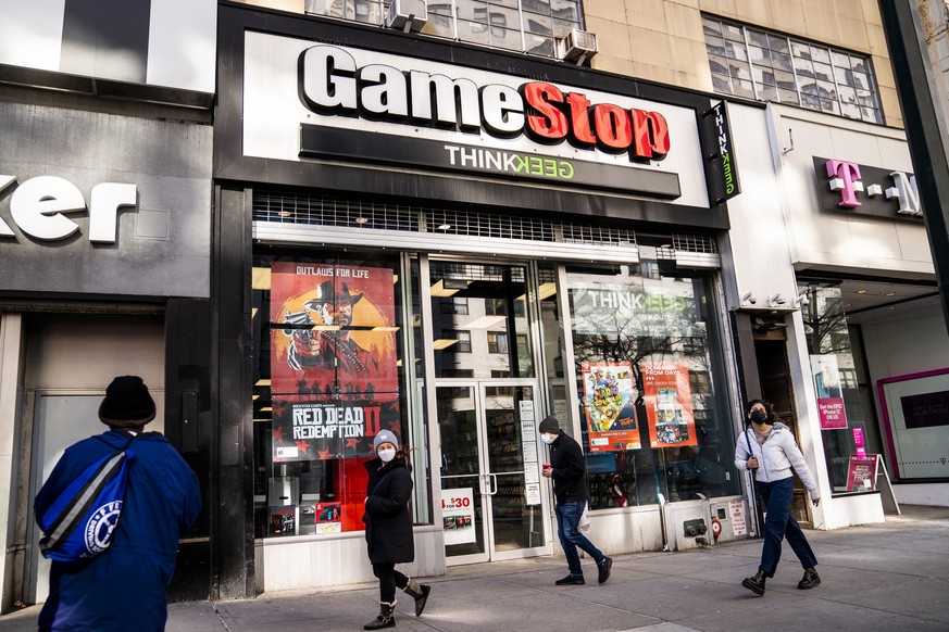 FILE - Pedestrians pass a GameStop store on 14th Street at Union Square, Thursday, Jan. 28, 2021, in the Manhattan borough of New York. The GameStop saga has been portrayed as a victory of the little  ...