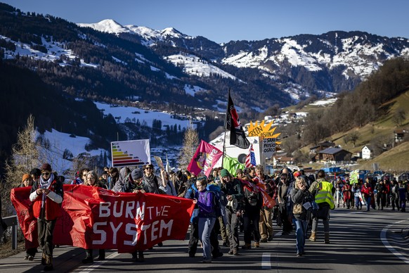 Protestors hike during a demonstration of the organization &quot;Strike WEF&quot; before the annual meeting of the World Economic Forum, WEF, in Saas im Praettigau, Switzerland, on Saturday, January 1 ...