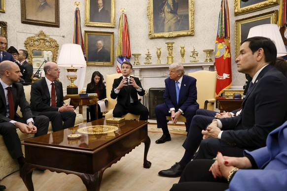 France's President Emmanuel Macron speaks as Secretary of State Marco Rubio, from right, and President Donald Trump listen during a meeting in the Oval Office of the White House in Washington, Mo ...