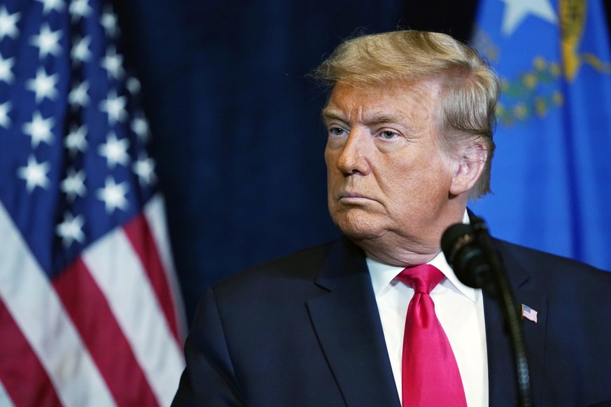 FILE - In this Wednesday, Oct. 28, 2020, file photo, President Donald Trump listens as Nevada business leaders talk at Trump International Hotel Las Vegas, in Las Vegas. The Biden administration says  ...