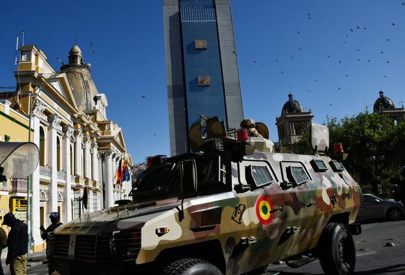 240627 -- LA PAZ, June 27, 2024 -- A military vehicle is seen near the government palace in La Paz, Bolivia, June 26, 2024. Bolivian President Luis Arce on Wednesday denounced what appeared to be an a ...
