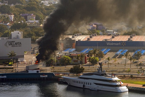 epaselect epa12770450 An aerial photograph shows plumes of smoke rising after violent reactions to the killing of Nemesio Ruben Oseguera Cervantes, known as El Mencho, leader of the Jalisco New Genera ...