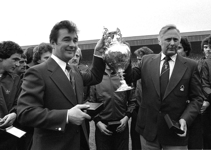 April 30, 1978 photo of Nottingham Forest soccer team manager Brian Clough, left, and assistant manager Peter Taylor, holding the English League Championship trophy after it had been presented to Fore ...