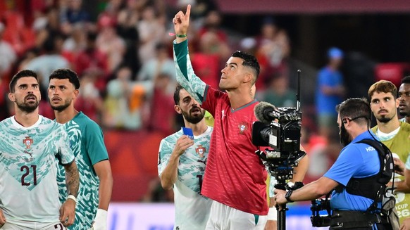 epa13082018 Cristiano Ronaldo of Portugal (C), wearing the shirt of his late teammate Diogo Jota, and his teammates greet supporters after winning the FIFA World Cup 2026 Round of 32 match Portugal ag ...
