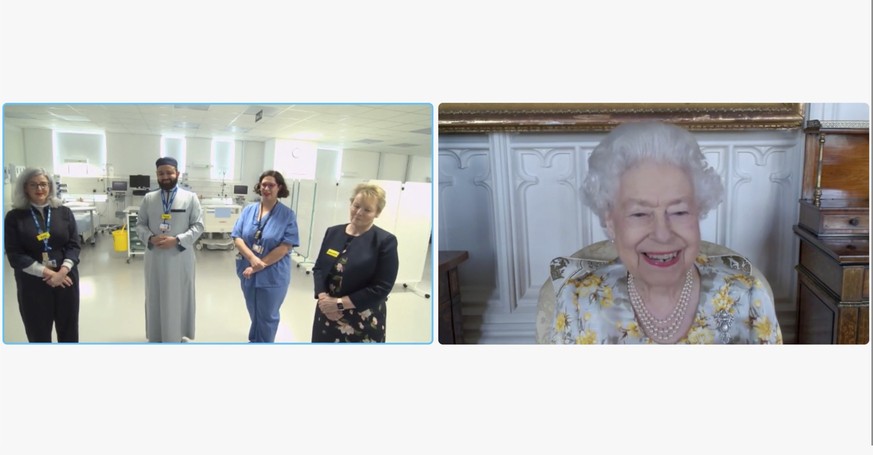 In this image from video issued by Buckingham Palace on Sunday, April 10, 2022, Britain&#039;s Queen Elizabeth II speaks to Polly Fitch, clinical psychologist; Imam Faruq Siddiqi, chaplain; Mireia Lop ...