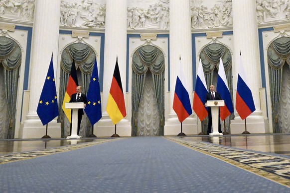 Russian President Vladimir Putin, right, and German Chancellor Olaf Scholz attend a joint news conference following their talks in the Kremlin in Moscow, Russia, Tuesday, Feb. 15, 2022. Putin says Mos ...