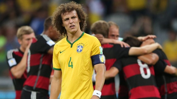 JAHRESRUECKBLICK 2014 - FUSSBALL WM 2014 - Brazil&#039;s captain David Luiz reacts while German player a goal during the FIFA World Cup 2014 semi final match between Brazil and Germany at the Estadio  ...