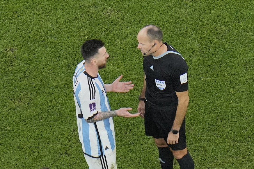 Argentina&#039;s Lionel Messi, left, argues with referee Mateu Lahoz during the World Cup quarterfinal soccer match between the Netherlands and Argentina, at the Lusail Stadium in Lusail, Qatar, Frida ...