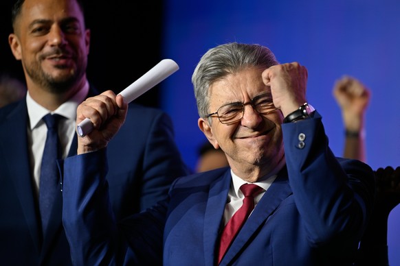French far-left leader Jean-Luc Melenchon, right, and far-left party La France Insoumise (LFI) candidate for Marseille mayoral election Sebastien Delogu attend a mayoral campaign meeting, in Marseille ...