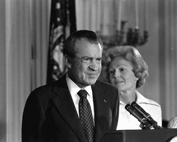 FILE - In this Aug. 9, 1974 black-and-white file photo, President Richard M. Nixon and his wife Pat Nixon are shown standing together in the East Room of the White House in Washington. Thirty-six year ...