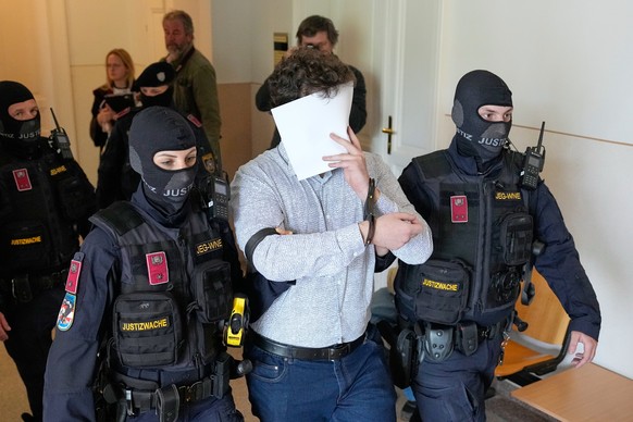 FILE - Defendant Beran A. is returned to the courtroom in the District Court in Wiener Neustadt, Austria, where he stands trial for plotting to carry out an attack on one of superstar singer Taylor Sw ...
