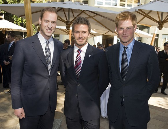 JOHANNESURG - JUNE 19: (N0 PUBLICATION IN UK MEDIA FOR 28 DAYS) Prince William, Prince Harry and David Beckham attend a reception for FIFA officials on behalf of the English Football Association in ho ...