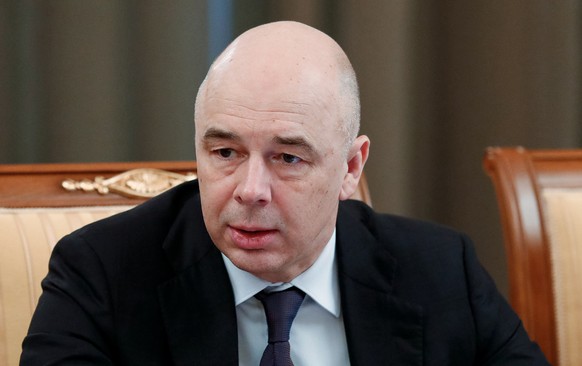 Finance Minister Anton Siluanov attends a cabinet meeting in Moscow, Russia, Thursday, March 12, 2020. Russia says it will completely cut the dollar from its rainy day fund, a move intended to counter ...