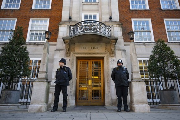 LONDON, UNITED KINGDOM - JANUARY 18: Police officers stand guard outside the London Clinic after the UK&#039;s Princess of Wales, Kate Middleton underwent planned surgery in London, United Kingdom on  ...