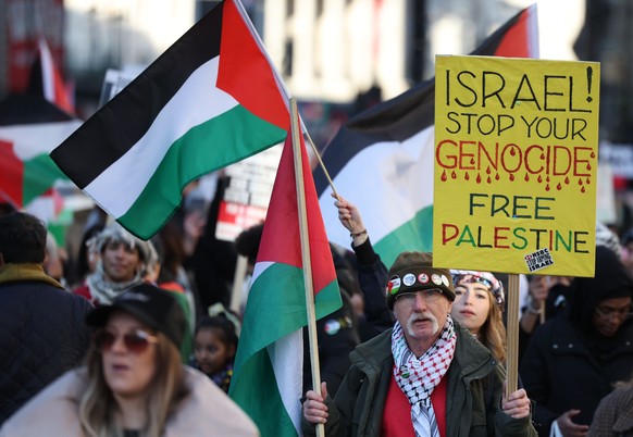 epa10994757 Demonstrators at a pro-Palestinian march in London, Britain, 25 November 2023. Thousands of Israelis and Palestinians have died since the militant group Hamas launched an unprecedented att ...