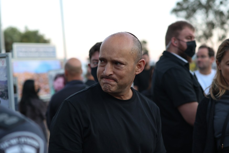 epa13286374 Former Israeli Prime Minister Naftali Bennett visits a memorial site for victims of the Nova music festival on the third anniversary of the 07 October attacks, near Re'im, southern Is ...