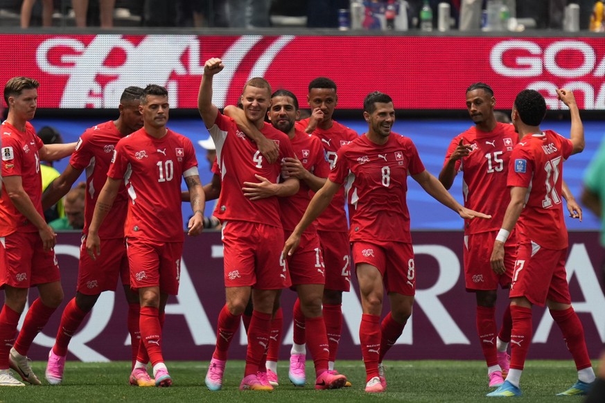 Switzerland's players celebrate after Granit Xhaka (10) scoring their side's 4th goal from the penalty spot during the World Cup Group B soccer match between Switzerland and Bosnia in Inglew ...