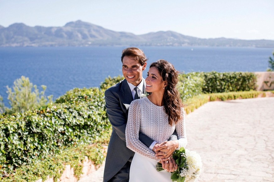 epa07937506 A handout photo made available by Rafa Nadal Foundation shows Spanish tennis player Rafa Nadal (L) and his wife Mery Perello (R) during their wedding in sa Fortalesa, Pollenca, Balearics,  ...