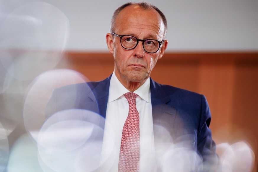 epa12272164 German Chancellor Friedrich Merz looks on at the start of a cabinet meeting of the federal government in Berlin, Germany, 30 July 2025. EPA/CLEMENS BILAN