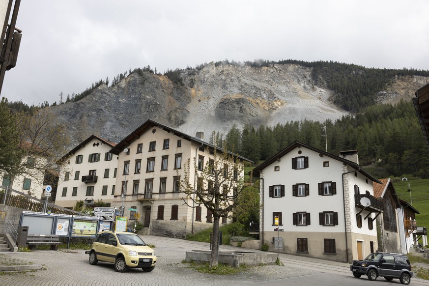 FILE - Residential buildings stand in front of the &quot;Brienzer Rutsch&quot; the rockfall danger zone in Brienz-Brinzauls, Switzerland, Friday, May 12, 2023. Residents of a Swiss village that faces  ...