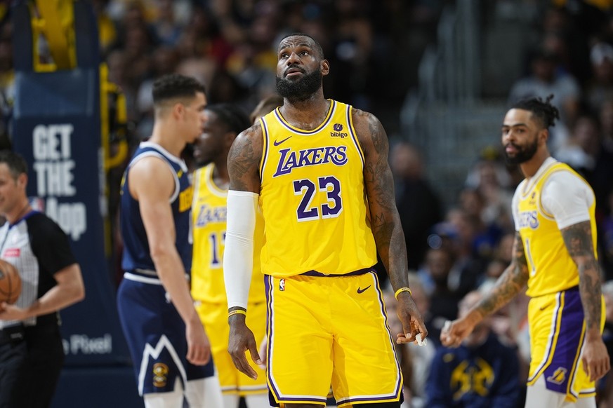 Los Angeles Lakers forward LeBron James (23) checks the scoreboard in the first half of Game 5 of an NBA basketball first-round playoff series against the Denver Nuggets, Monday, April 29, 2024, in De ...