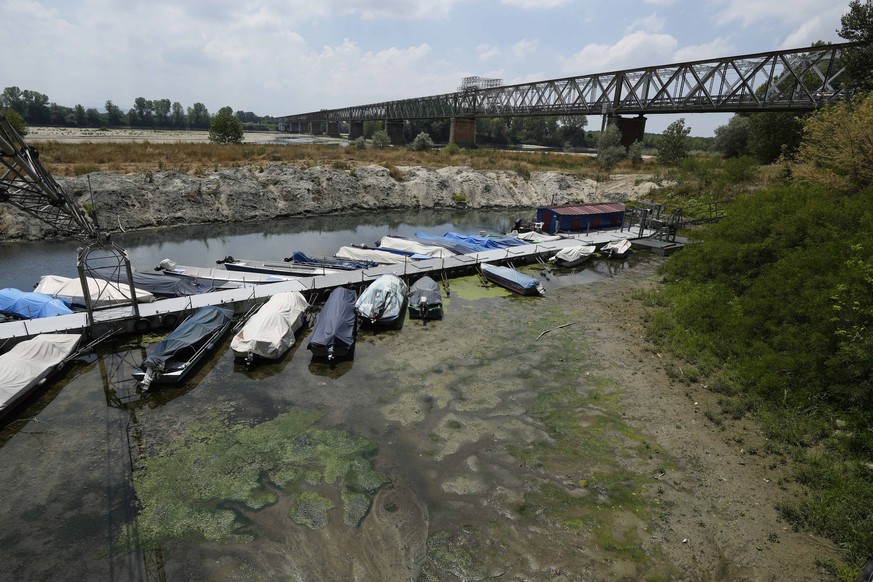 A view of the Ponte della Becca (Becca bridge) on the Po river shows the effects of the drought, in Linarolo, near Pavia, Italy, Saturday, June 25, 2022. The mayor of Milan signed an ordinance Saturda ...