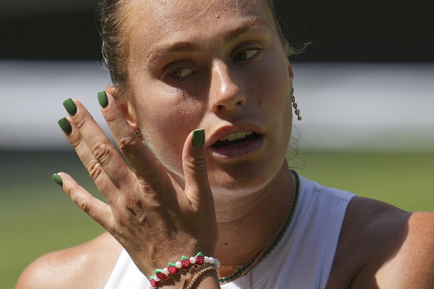 Aryna Sabalenka of Belarus wipes her face as she plays Amanda Anisimova of the U.S. during a women&#039;s singles semifinal match at the Wimbledon Tennis Championships in London, Thursday, July 10, 20 ...