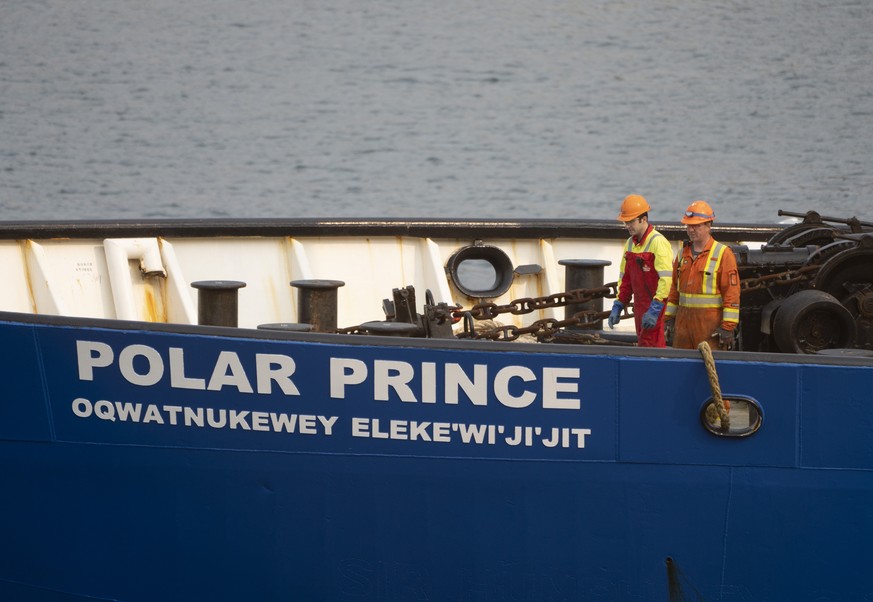 Crew members of the Polar Prince prepare to dock the ship as it arrives at the Coast Guard wharf, Saturday, June 24, 2023 in St. John&#039;s, Newfoundland. Authorities from the U.S. and Canada began t ...
