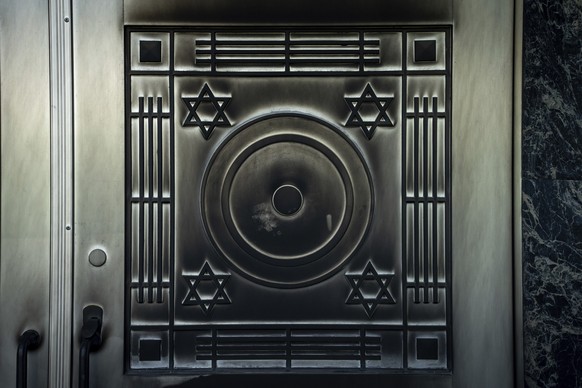 A metal plated on a door at the Schara Tzedeck synagogue is blackened, Friday, May 31, 2024, in Vancouver, British Columbia. The Jewish Federation of Greater Vancouver says an &quot;incendiary device& ...