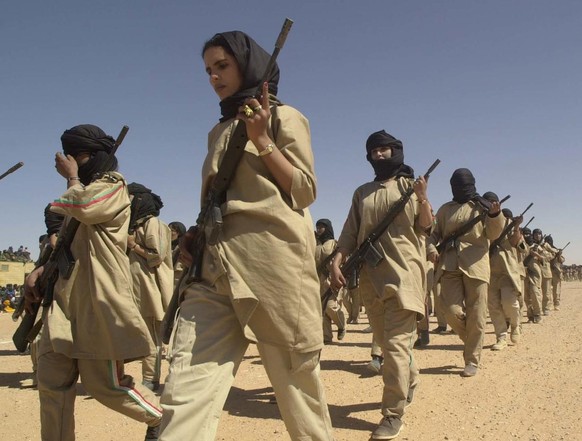 A woman&#039;s division of the Polisario Front army march in the El Ayoun refugee camp, south eastern Algeria, Tuesday Feb. 27, 2001 to celebrate the 25th anniversary of the Saharawi Arab Democratic R ...