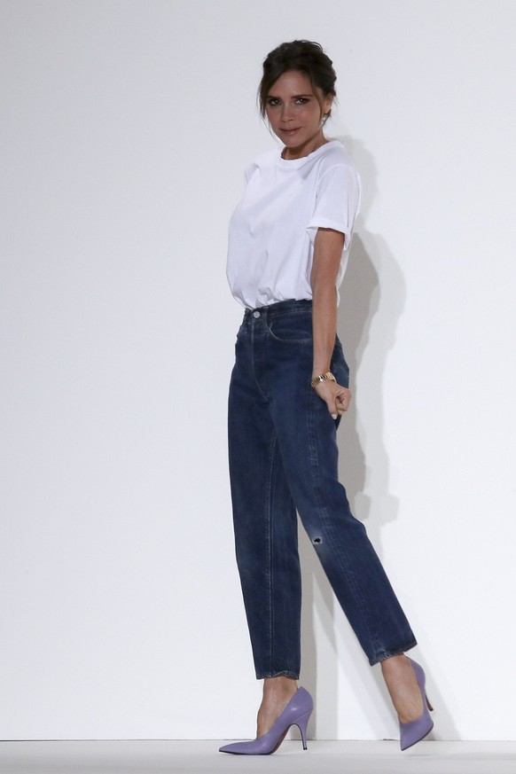 Victoria Beckham acknowledges the audience at the end of her Spring/Summer 2018 fashion show during New York Fashion Week, Sunday, Sept. 10, 2017. (AP Photo/Mary Altaffer)