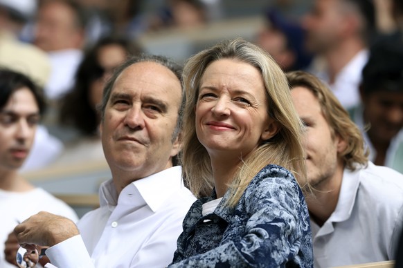 Founder of French broadband Internet provider Iliad Xavier Niel, left, and his wife Louis Vuitton Executive vice president Delphine Arnault wait for the start of the final match of the French Open ten ...