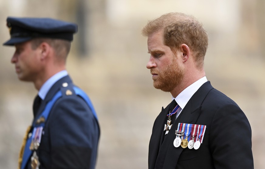 Britain&#039;s Prince William and Prince Harry join the Procession following the State Hearse carrying the coffin of Queen Elizabeth II towards St George&#039;s Chapel, Windsor, Monday Sept. 19, 2022. ...