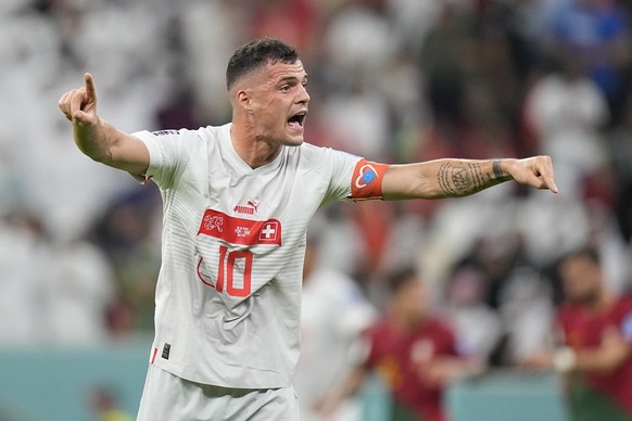 Switzerland&#039;s Granit Xhaka gestures during the World Cup round of 16 soccer match between Portugal and Switzerland, at the Lusail Stadium in Lusail, Qatar, Tuesday, Dec. 6, 2022. (AP Photo/Pavel  ...