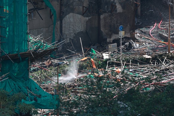 epa12554082 A view of the rubble left in the aftermath of the Tai Po apartment fire in Hong Kong, China, 28 November 2025. The fire, which started on 26 November, has killed at least 94 people, and le ...