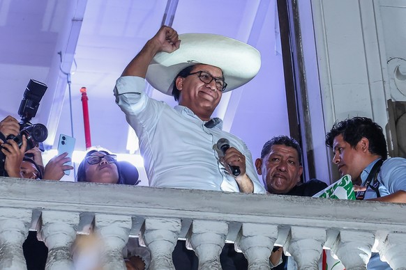 epa13023672 Peruvian presidential candidate Roberto Sanchez greets supporters as exit poll results are released during the second round of elections in Lima, Peru, 07 June 2026. More than 27 million P ...